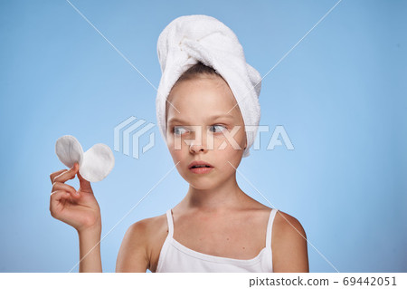 girl with a towel on her head cotton pads skin care lifestyle hygiene 69442051