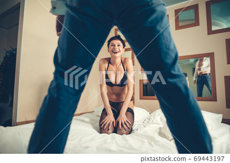 Emotional sexy scene young woman undressing her partner 69443197