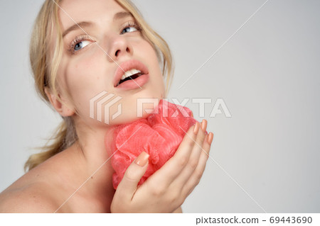 pretty blonde pink washcloth in hand bare shoulders clear skin showering pretty blonde pink washcloth in hand bare shoulders clear skin showering 69443690
