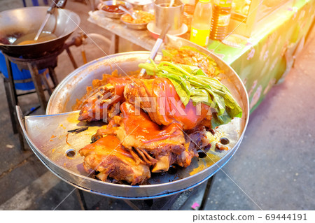 Stewed pork legs and  vegetable on steaming pot street food in T 69444191