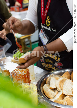 Chef cooking a food for show and sale to customers 69446405