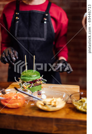 Fresh tasty burger and on wooden table 69446713
