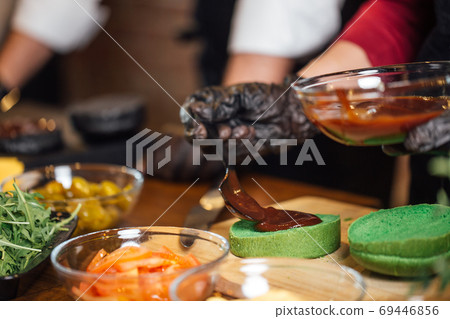 Chef making beef burgers at burger pub Chef making beef burgers at burger pub 69446856