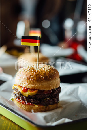 Fresh tasty burger and on wooden table 69447530