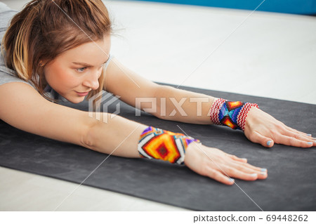fitness woman stretching her hands exercising yoga in hall fitness woman stretching her hands exercising yoga in hall 69448262
