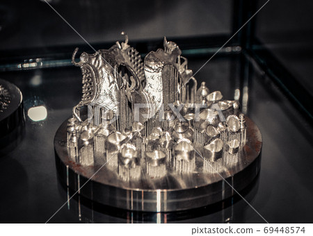 Object printed on metal 3d printer close-up. Object printed on metal 3d printer close-up. 69448574