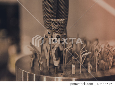 Object printed on metal 3d printer close-up. Object printed on metal 3d printer close-up. 69448646