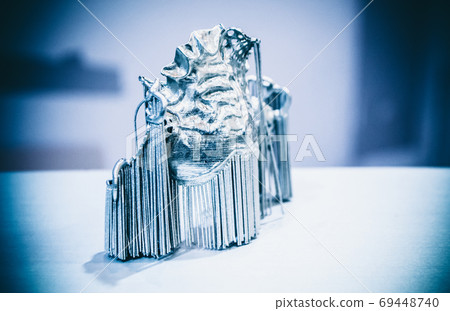 Dental crowns printed in laser sintering machine. Modern 3D printer 69448740