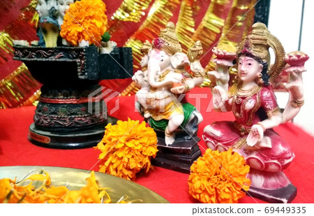 Lord Ganesha and Goddess Laxmi - Hindu religion and Indian celebration of Diwali festival Lord Ganesha and Goddess Laxmi - Hindu religion and Indian celebration of Diwali festival 69449335