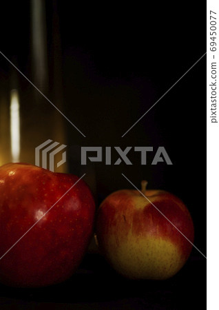 art photo abstract background from blurry spots of light and two red apple 69450077