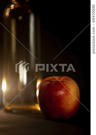 art photo abstract background from blurry spots of light and red apple 69450086