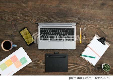 Overview of workplace of contemporary creative fashion designer with supplies 69450260