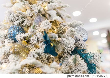 Christmas tree with colorful baubles. Holidays and decor concept. Christmas tree with colorful baubles. Holidays and decor concept. 69450775