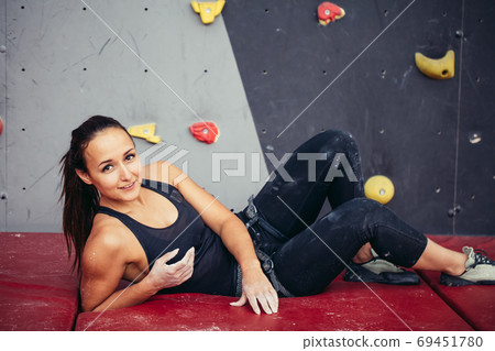 Portrait of happy woman with rope in fitness studio 69451780