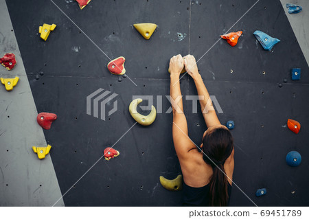 Portrait of happy woman with rope in fitness studio 69451789