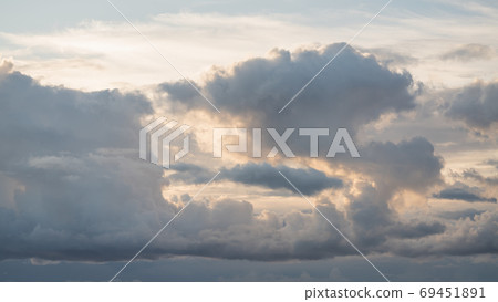 Evening sky with clouds and warm sun light 69451891