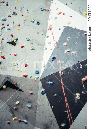 Artificial rock climbing wall with toe and hand hold studs. 69451961