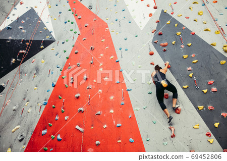 teenage girl in a free climbing wall teenage girl in a free climbing wall 69452806