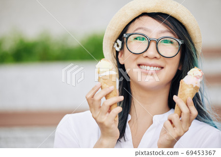 Chinese woman with ice cream 69453367
