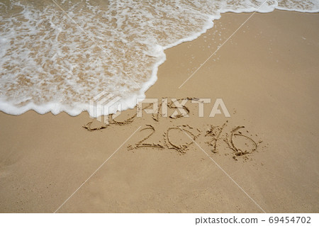 2015 and 2016 year on the sand beach 69454702