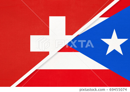Switzerland and Puerto Rico, symbol of national flags from textile. Championship between two countries. Switzerland and Puerto Rico, symbol of national flags from textile. Championship between two countries. 69455074