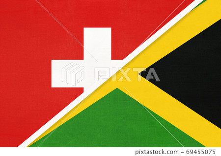 Switzerland and Jamaica, symbol of national flags from textile. Championship between two countries. Switzerland and Jamaica, symbol of national flags from textile. Championship between two countries. 69455075