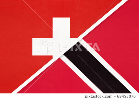 Switzerland and Trinidad and Tobago, symbol of national flags from textile. Championship between two countries. Switzerland and Trinidad and Tobago, symbol of national flags from textile. Championship between two countries. 69455076