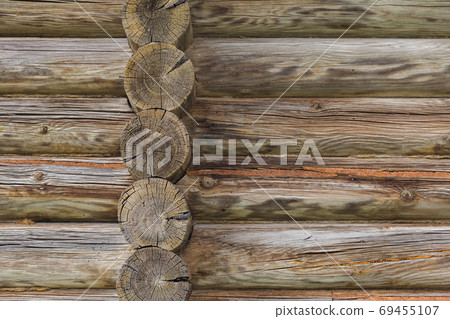 Wall of logs of an old wooden house - architecture background Wall of logs of an old wooden house - architecture background 69455107