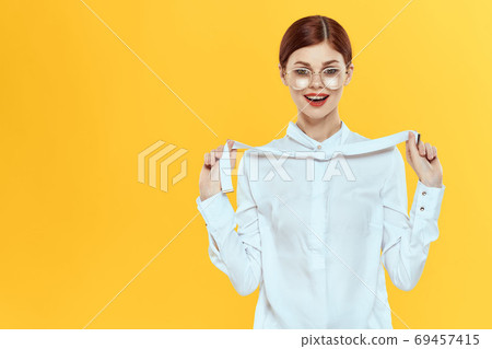woman in white shirt wearing glasses red lips elegant style yellow isolated background woman in white shirt wearing glasses red lips elegant style yellow isolated background 69457415