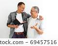 Senior father with adult son talking, isolated white background. 69457516