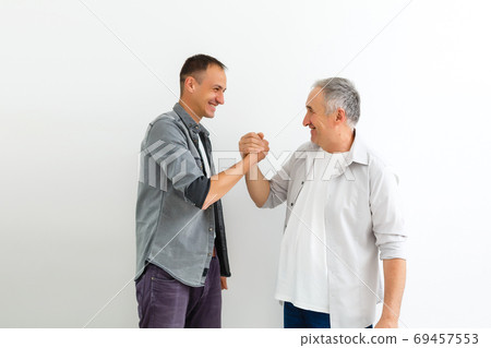 Senior Father With Adult Son on a white background 69457553