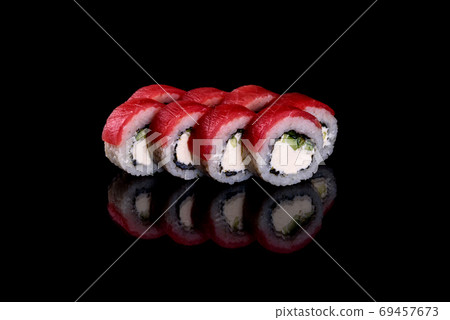 Fresh delicious beautiful sushi rolls on a dark background 69457673