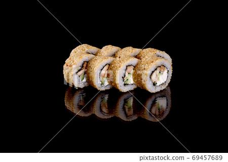 Fresh delicious beautiful sushi rolls on a dark background Fresh delicious beautiful sushi rolls on a dark background 69457689