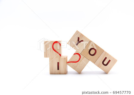 Wooden dice with a broken heart and the words ME and YOU 69457770