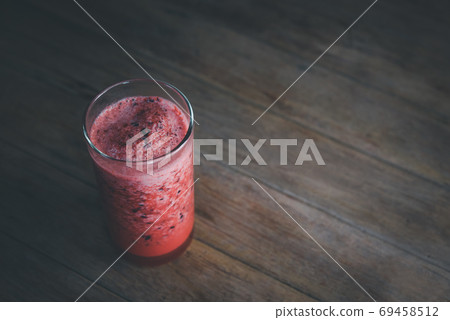 Karonda Fruit spinning with ice smoothie juice 69458512