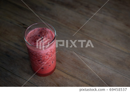 Karonda Fruit spinning with ice smoothie juice 69458537
