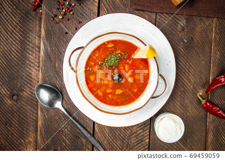 Russian soup solyanka with smoked meats Russian soup solyanka with smoked meats 69459059