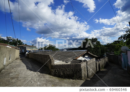 Alley. Sky. Clouds. Redevelopment Alley. Sky. Clouds. Redevelopment 69460346