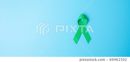 green Ribbon color on blue background for supporting people livi 69461502