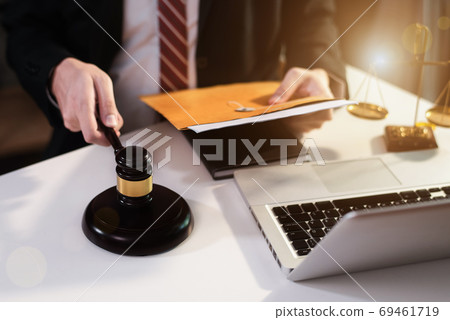 Lawyer singing in documents, filling court records, job responsibilities in office. 69461719