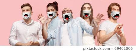 Group of frightened people, women and men wearing protective face mask on pink coral background 69461806