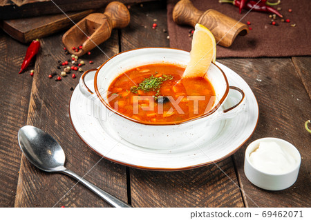 Russian soup solyanka with smoked meats Russian soup solyanka with smoked meats 69462071