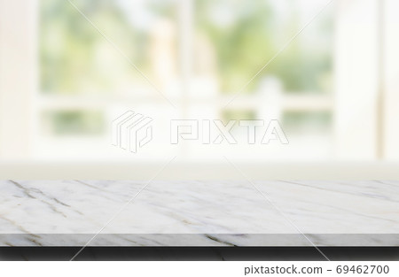 Marble stone table top grunge texture background with blurry image of living room in background. 69462700