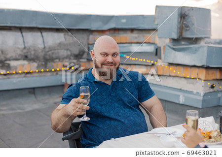 Handsome bearded man with glass of champagne. Handsome bearded man with glass of champagne. 69463021
