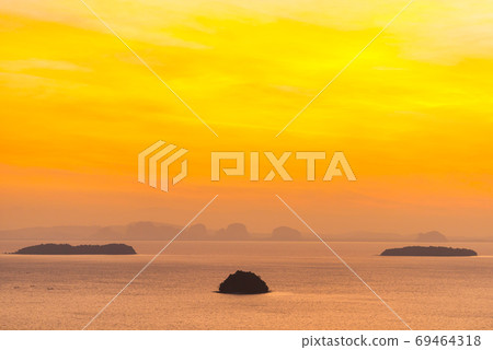 Small island on sunset sea Small island on sunset sea 69464318