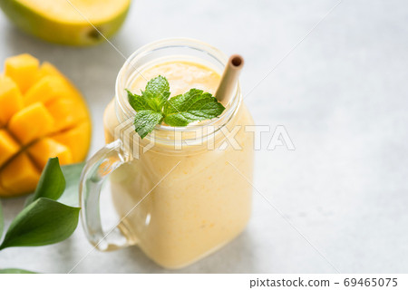 Mango lassi in a glass Mango lassi in a glass 69465075