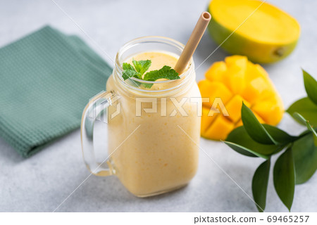 Tasty vegetarian mango smoothie Tasty vegetarian mango smoothie 69465257