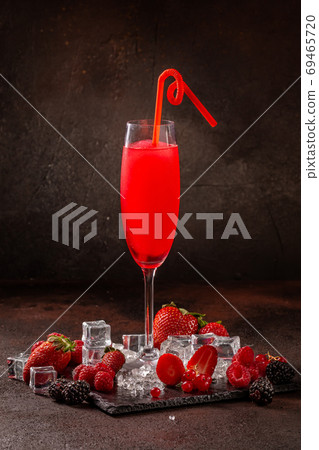 Delicious cold refreshing smoothie drink in cocktail glass with strawberry Delicious cold refreshing smoothie drink in cocktail glass with strawberry 69465720
