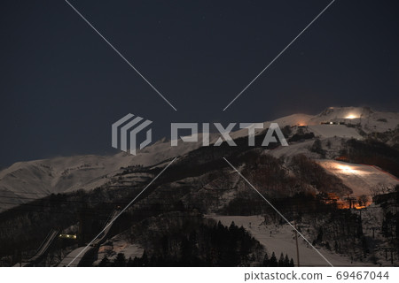 Night view of the jumping platform in the direction of the Northern Alps (Mt. Goryu / Mt. Kashimayarigadake) seen from Hakuba Village in Nagano 69467044