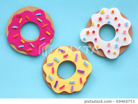 Handmade colorful paper cutout donuts for your design. Handmade colorful paper cutout donuts for your design. 69468753